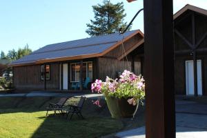 a house with a potted plant in front of it at Family Cabin Unit 8 in Rea +11 photos