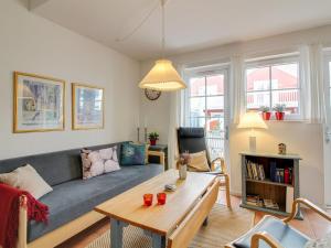 a living room with a couch and a table at Apartment Sote - 1-2km from the sea in Western Jutland by Interhome in Blåvand
