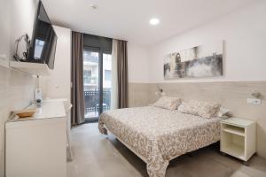 Posteľ alebo postele v izbe v ubytovaní Hostal House