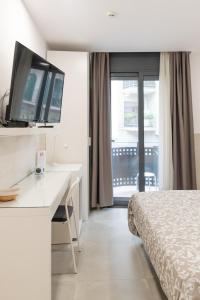 Posteľ alebo postele v izbe v ubytovaní Hostal House