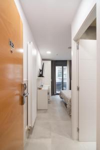 Posteľ alebo postele v izbe v ubytovaní Hostal House