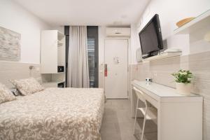 Posteľ alebo postele v izbe v ubytovaní Hostal House