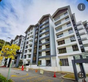 a large white apartment building with many windows at Ammara homestay @ Palas Horizon kea Farm in Brinchang