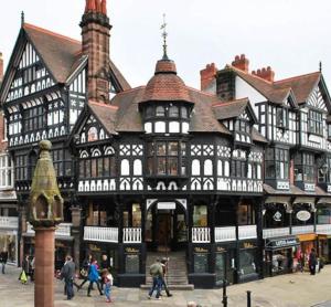 a large building with people walking in front of it at Cosy 3 Bed in the heart of Chester in Chester