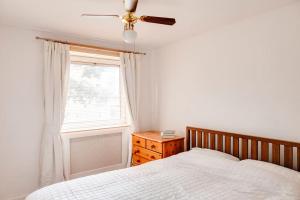 a bedroom with a bed and a window at Cosy 3 Bed in the heart of Chester in Chester +13 photos