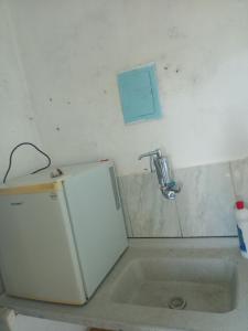Ein Badezimmer in der Unterkunft Kitnet gratiluz