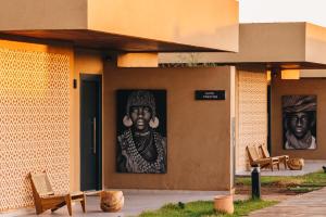 a building with a mural on the side of it at Tulum Beach Resort Dakhla in Dakhla