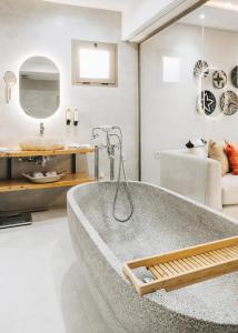 a bathroom with a large tub in a room at Tulum Beach Resort Dakhla in Dakhla