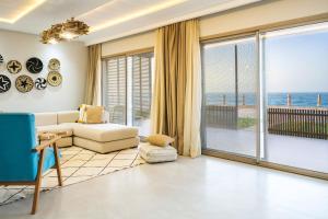 a living room with a view of the ocean at Tulum Beach Resort Dakhla in Dakhla