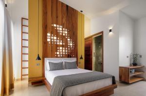 Een bed of bedden in een kamer bij Villa Nautica Boutique Hotel