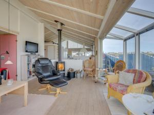 a living room with a view of the ocean at Holiday Home Rajna - 95m to the inlet by Interhome in Lemvig
