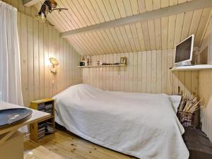 A bed or beds in a room at Holiday Home Iskra - 900m from the sea in NW Jutland by Interhome
