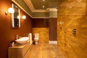 a bathroom with a toilet and a sink and a shower at Harrogate Victorian Luxury in Harrogate +74 photos