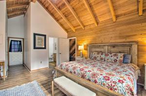 een slaapkamer met een bed en een houten muur bij Wintergreen Home with Deck - Near Skiing and Hiking! in Wintergreen