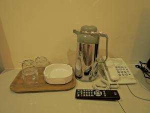 a blender and a remote control on a counter at Hotel Seri Nilai in Nilai