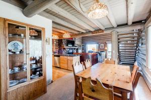 a dining room with a wooden table and chairs at Temptation 8 condo in Park City