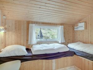 Postel nebo postele na pokoji v ubytování Holiday Home Mylius - 100m from the sea by Interhome
