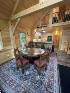 a dining room with a table and chairs in a cabin at MAINE PINES LMIT 8 home in Denmark