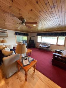 a living room with a couch and a table at TREMONT LIMIT 10 villa in Bridgton