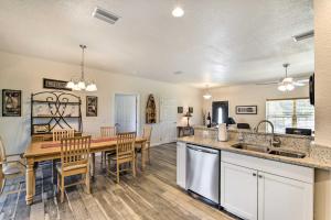 a kitchen and dining room with a table and chairs at Canal-Front Home with Boat Dock in Crystal River in Crystal River