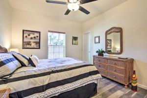 a bedroom with a bed and a dresser and a mirror at Canal-Front Home with Boat Dock in Crystal River in Crystal River