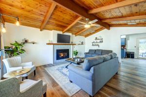 a living room with a couch and a fireplace at Dog-Friendly Oakhurst Home Walk to Downtown! in Oakhurst