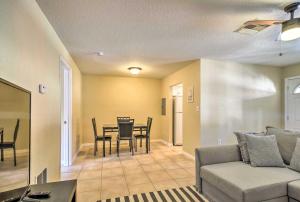 a living room with a couch and a table at Sunny Indian Rocks Beach Condo Steps to Gulf! in Clearwater Beach