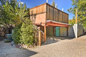 a house with a green door and a fence at Taos Studio with Shared Hot Tub in Historic District in Taos