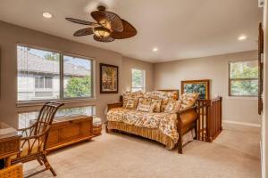 a bedroom with a bed and a ceiling fan at Mauna Lani Palm Villas H-4 Amazing View Corner Unit in Waikoloa