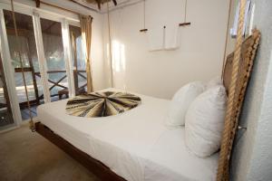 Postel nebo postele na pokoji v ubytování Hotel Ak'Na Holbox