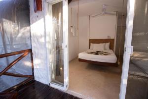 Postel nebo postele na pokoji v ubytování Hotel Ak'Na Holbox