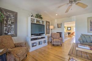 a living room with a television and a couch and chairs at Jersey Shore Getaway with Grill Walk to Beach! in Belmar