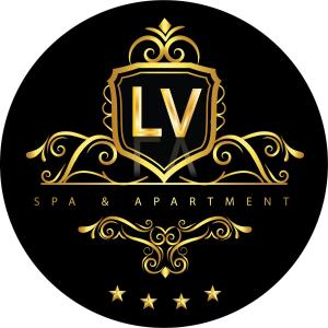 a gold and black logo with a capital letter l at LV Spa & Apartment in Ledinci