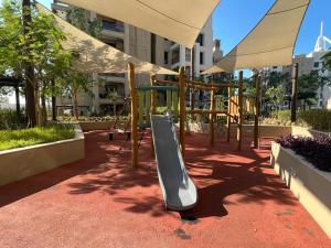 a playground with a slide in a building at Stylish 1 Bedroom Apartment Near Burj Al Arab (Madinat Jumeirah) in Dubai