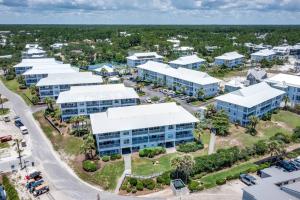 an aerial view of a campus with buildings at Short walk or shuttle to wide open public beach! in Santa Rosa Beach