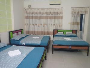 Postel nebo postele na pokoji v ubytování Motel Thanh Huyền