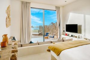 a bedroom with a bed and a large window at Tulum Beach Resort Dakhla in Dakhla