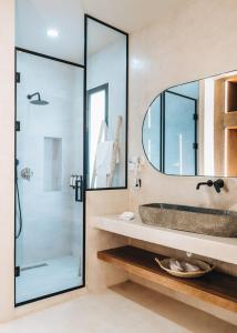 a bathroom with a sink and a mirror at Tulum Beach Resort Dakhla in Dakhla