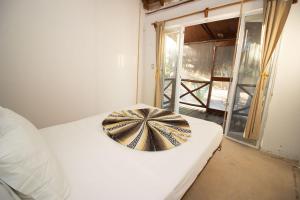 Postel nebo postele na pokoji v ubytování Hotel Ak'Na Holbox
