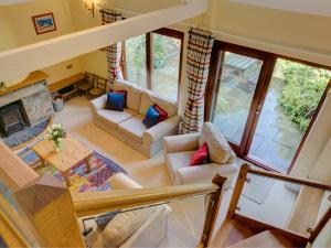 an overhead view of a living room with a fireplace at Brook Cottage in Newton Ferrers