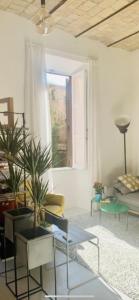 Area soggiorno di Sweet Life House Rome Cavour