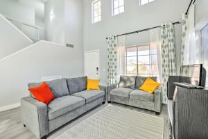 a living room with two couches and a television at Chandler Home with Yard and Grill 3 Mi to Downtown! in Chandler