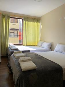 A bed or beds in a room at Delux apartment - 2 bedroom 2 bathroom