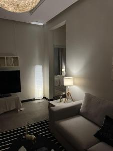 a living room with a couch and a bed at راحة Comfort in Riyadh