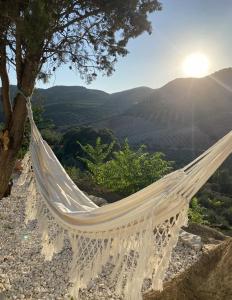 a hammock hanging from a tree with a view at Vista Las Colinas in Córdoba