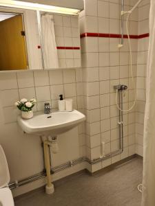 Een badkamer bij Noah Longstay Västerås