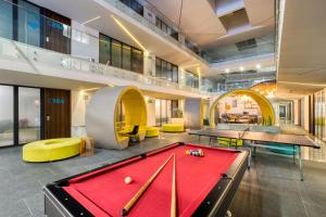 a billiard room with a red pool table at Eazy Rio by ULIV in Tijuana