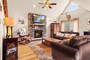 a living room with a couch and a fireplace at THE ONE Chalet in Albrightsville