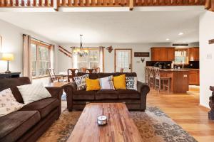 a living room with a couch and a table at THE ONE Chalet in Albrightsville