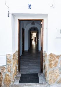 a hallway of a building with a hallway leading to a room at CASA RURAL LOS ALTOS in Ojuelos Altos